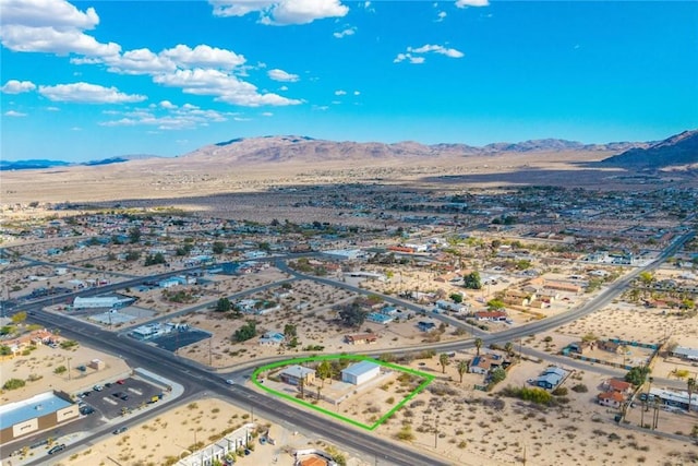 drone / aerial view with a mountain view and a desert view