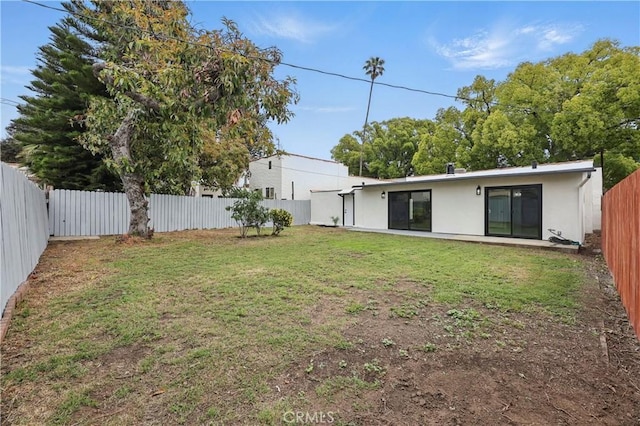 view of yard with a fenced backyard