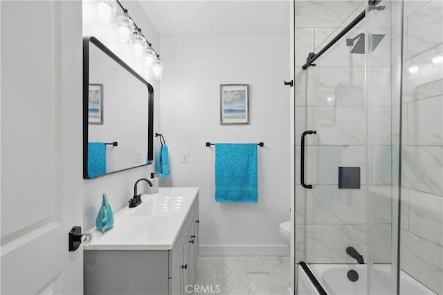 full bath featuring vanity, baseboards, bath / shower combo with glass door, and toilet
