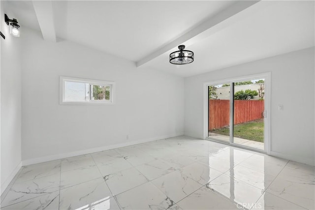 spare room with baseboards, beam ceiling, and marble finish floor