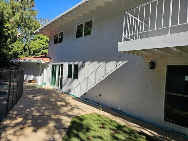 view of property exterior featuring a patio and stucco siding