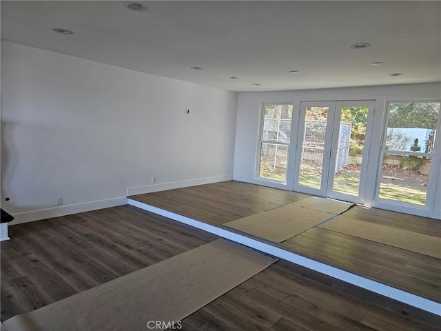 interior space with recessed lighting, baseboards, and wood finished floors