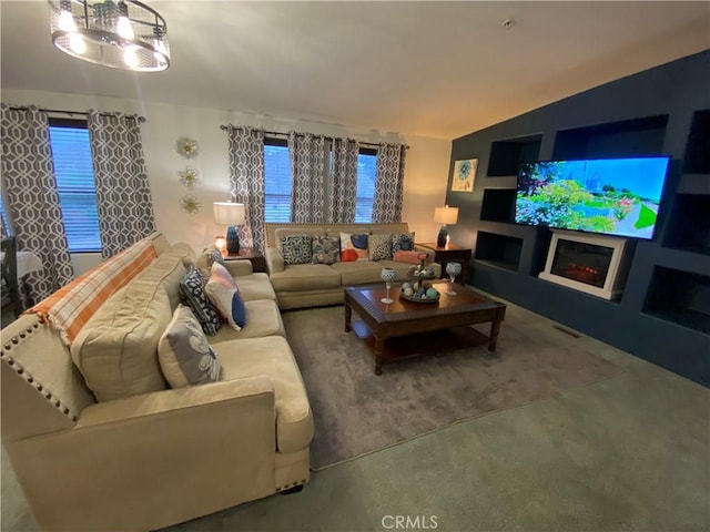 living room with a warm lit fireplace and lofted ceiling