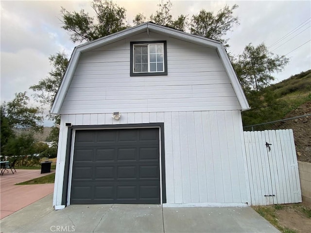 garage with concrete driveway
