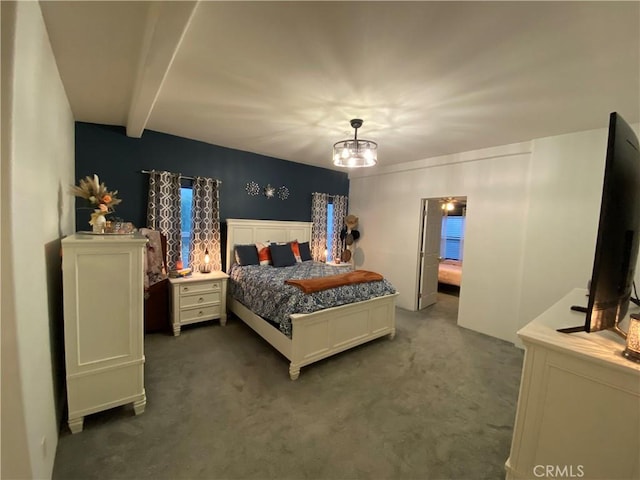 bedroom featuring carpet, beam ceiling, and a notable chandelier