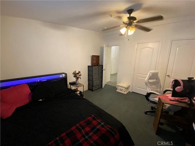 carpeted bedroom with a ceiling fan