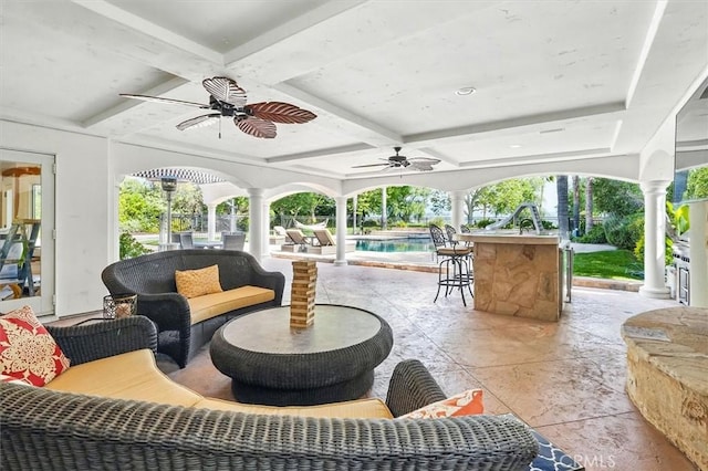 view of patio / terrace featuring a ceiling fan, an outdoor pool, and an outdoor hangout area