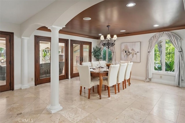 dining area featuring arched walkways, ornate columns, french doors, recessed lighting, and baseboards