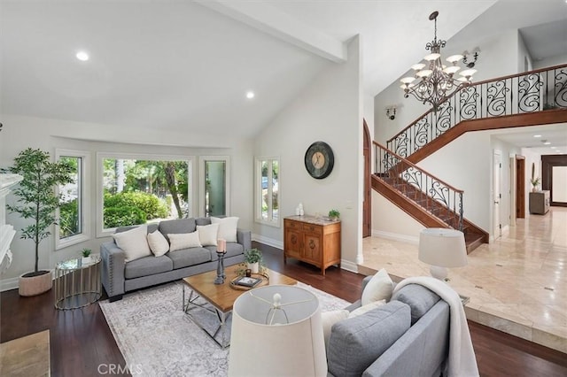 living room featuring high vaulted ceiling, beamed ceiling, stairway, a chandelier, and wood finished floors