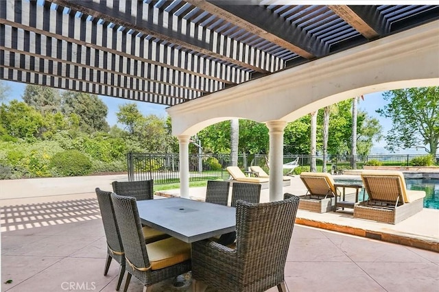 view of patio / terrace with a pergola and outdoor dining space