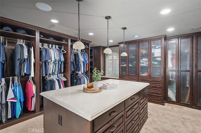 spacious closet featuring light carpet