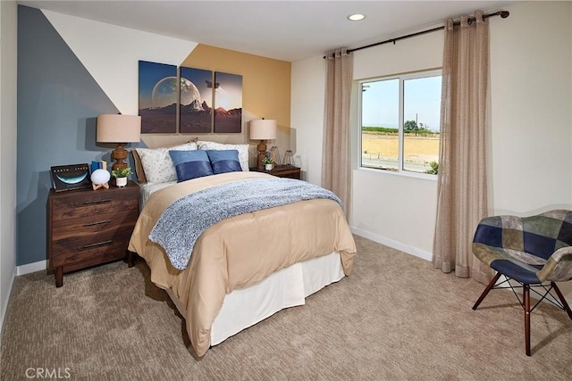 carpeted bedroom featuring baseboards and recessed lighting
