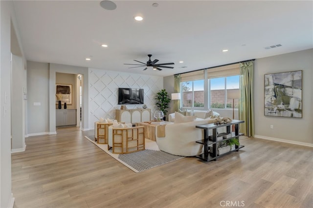 30973 Avenida Ramblas, Highland, CA 92346 - living room featuring ceiling fan, light wood-style flooring, recessed lighting, baseboards, and visible vents