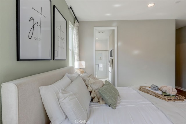 30973 Avenida Ramblas, Highland, CA 92346 - bedroom with recessed lighting and connected bathroom