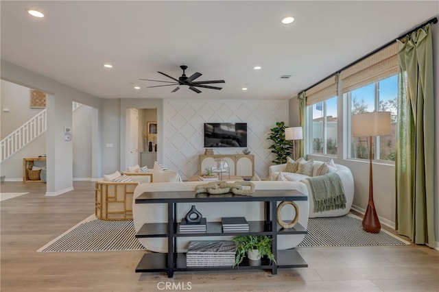 30973 Avenida Ramblas, Highland, CA 92346 - living area with ceiling fan, recessed lighting, baseboards, wood finished floors, and stairway