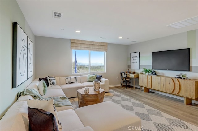 30973 Avenida Ramblas, Highland, CA 92346 - living room with recessed lighting, baseboards, visible vents, and light wood-type flooring