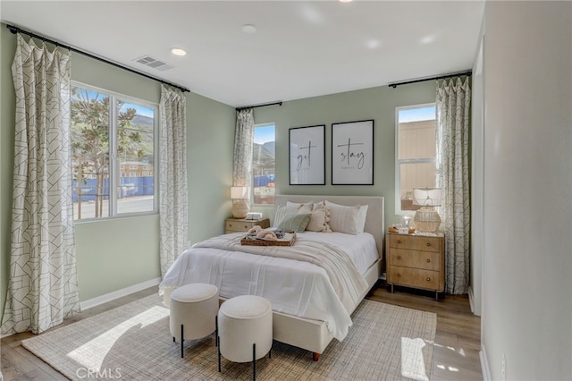 30973 Avenida Ramblas, Highland, CA 92346 - bedroom with visible vents, recessed lighting, baseboards, and wood finished floors