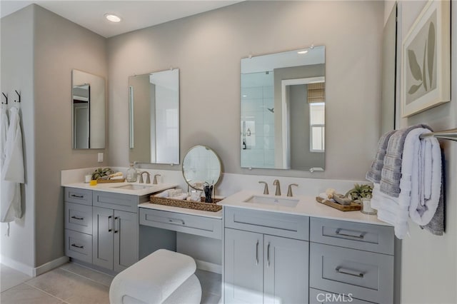 30973 Avenida Ramblas, Highland, CA 92346 - bathroom with baseboards, tile patterned floors, tiled shower, and vanity