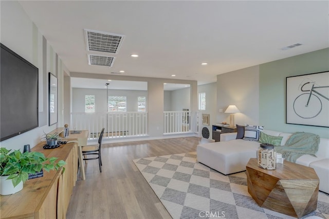 30973 Avenida Ramblas, Highland, CA 92346 - living area featuring recessed lighting, light wood-style flooring, and visible vents