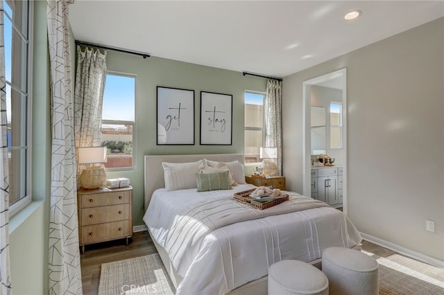 30973 Avenida Ramblas, Highland, CA 92346 - bedroom featuring baseboards, ensuite bath, recessed lighting, and wood finished floors