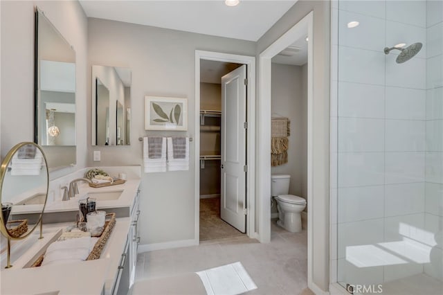 30973 Avenida Ramblas, Highland, CA 92346 - full bathroom featuring double vanity, toilet, a walk in closet, a sink, and a tile shower