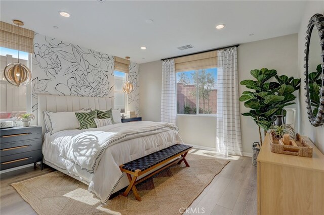 30973 Avenida Ramblas, Highland, CA 92346 - bedroom featuring multiple windows, recessed lighting, wood finished floors, and visible vents