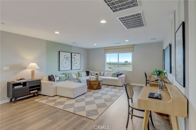 30973 Avenida Ramblas, Highland, CA 92346 - living room with recessed lighting, baseboards, visible vents, and light wood-style flooring