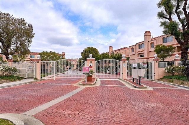 surrounding community featuring fence and a gate