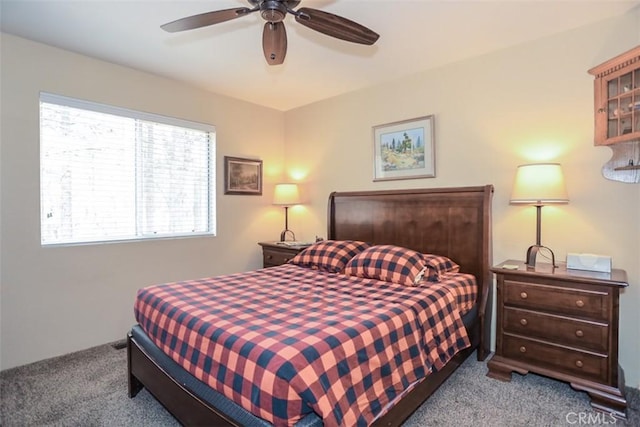 bedroom with ceiling fan and carpet