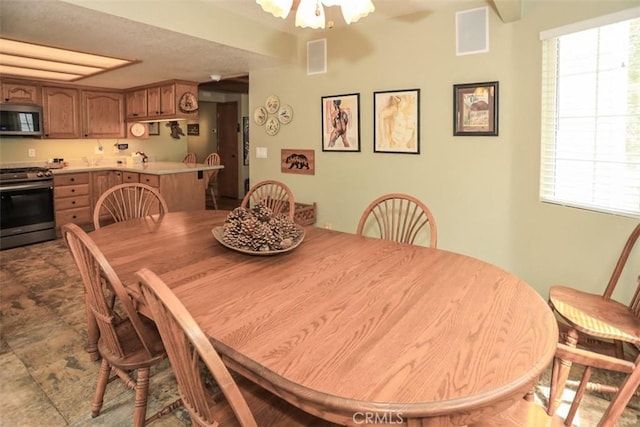 dining room with visible vents and plenty of natural light