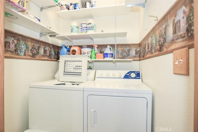 laundry room with separate washer and dryer and laundry area