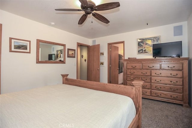 bedroom featuring dark colored carpet and a ceiling fan