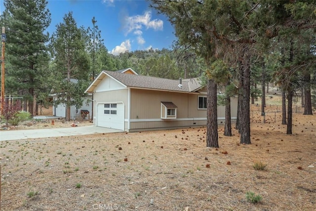 exterior space featuring a garage and driveway