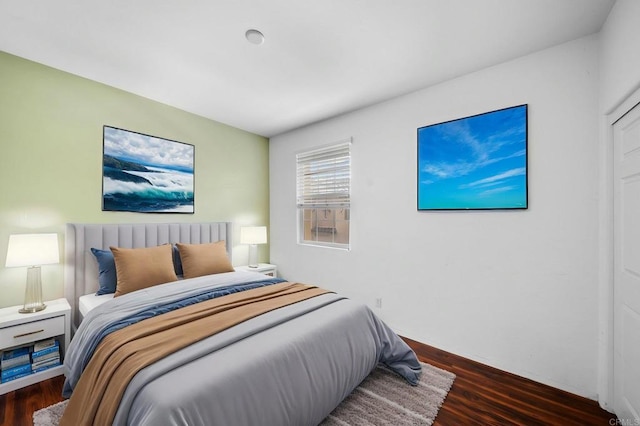 bedroom with wood finished floors