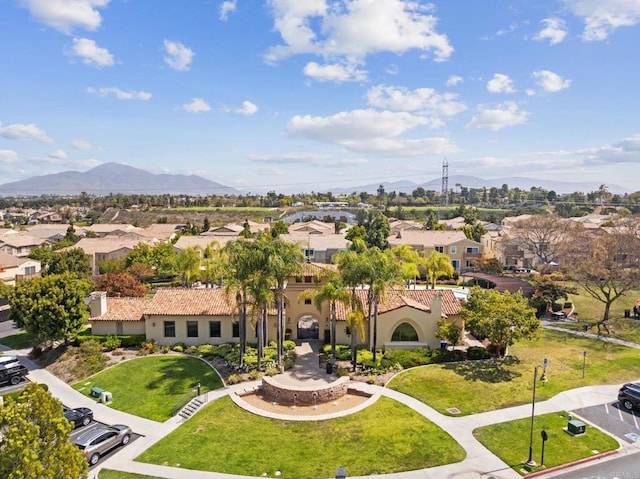 drone / aerial view featuring a residential view and a mountain view
