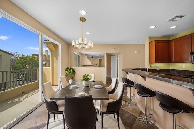 dining space featuring visible vents, recessed lighting, and a chandelier