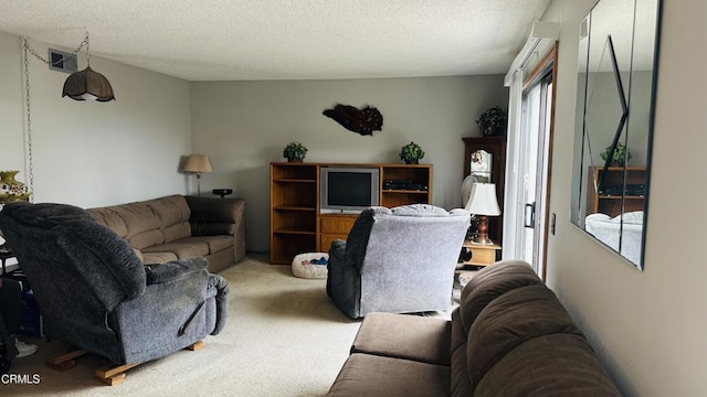 living room featuring a textured ceiling, light colored carpet, and visible vents