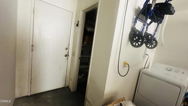 laundry room with laundry area and washer / dryer