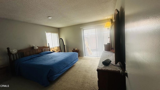carpeted bedroom with a textured ceiling