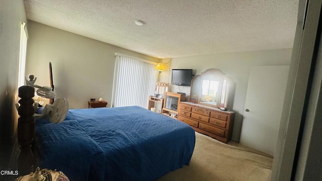 carpeted bedroom featuring multiple windows and a textured ceiling