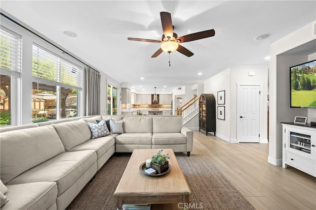 26544 Mahonia Way, Murrieta, CA 92562 - living room with a ceiling fan, light wood-style flooring, stairway, and recessed lighting
