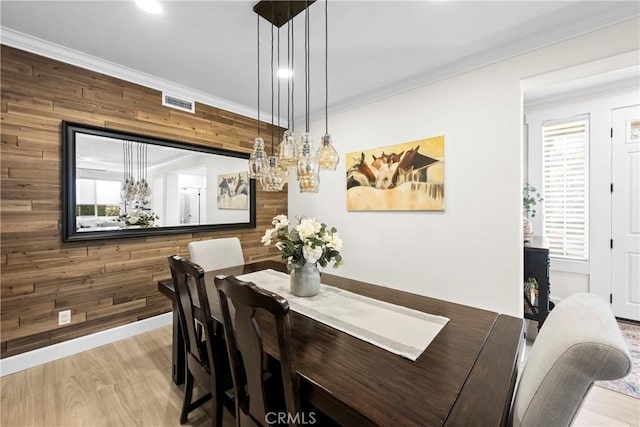 26544 Mahonia Way, Murrieta, CA 92562 - dining space featuring wood walls, a chandelier, wood finished floors, and crown molding