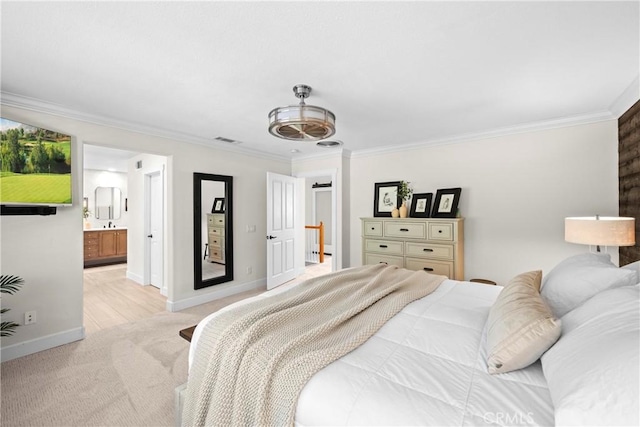 26544 Mahonia Way, Murrieta, CA 92562 - bedroom with light colored carpet, crown molding, and ensuite bath