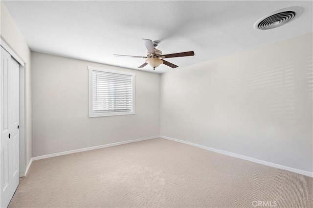 26544 Mahonia Way, Murrieta, CA 92562 - unfurnished bedroom featuring a closet, light colored carpet, and ceiling fan