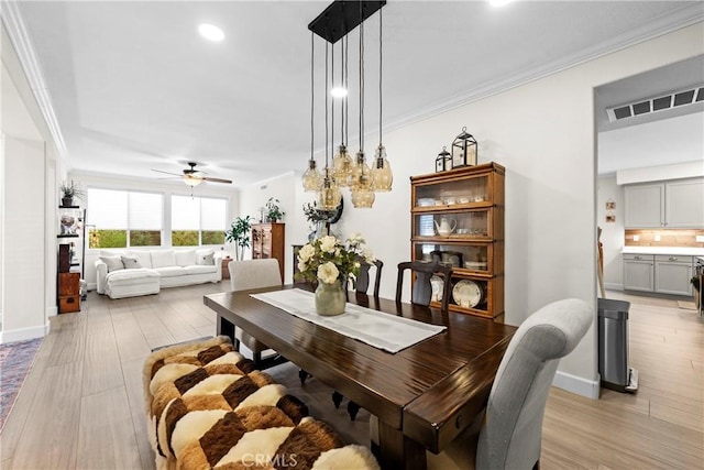 26544 Mahonia Way, Murrieta, CA 92562 - dining room with ornamental molding, light wood-style flooring, ceiling fan, and recessed lighting