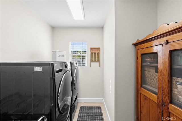 26544 Mahonia Way, Murrieta, CA 92562 - laundry area featuring washer and clothes dryer and baseboards