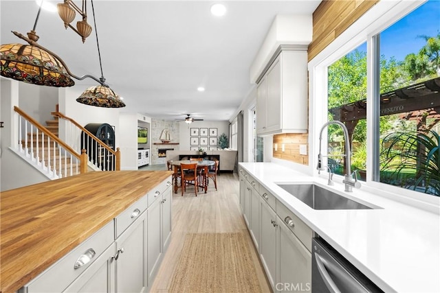 26544 Mahonia Way, Murrieta, CA 92562 - kitchen featuring recessed lighting, light wood-style flooring, dishwasher, decorative backsplash, and wood counters