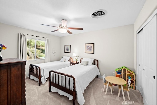 26544 Mahonia Way, Murrieta, CA 92562 - bedroom with light colored carpet, a closet, and a ceiling fan