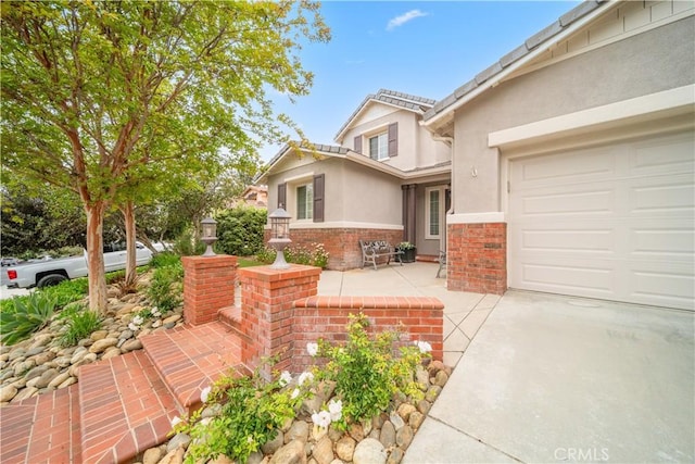 26544 Mahonia Way, Murrieta, CA 92562 - view of front facade with stucco siding and brick siding