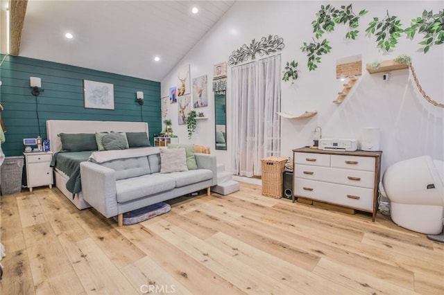 bedroom featuring recessed lighting, light wood-style flooring, and high vaulted ceiling